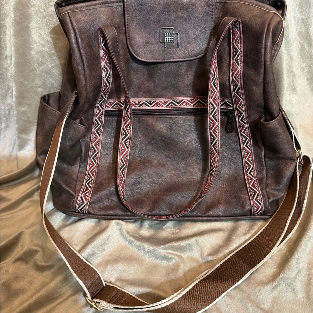 Brown Leather Backpack With Patterned Straps - image 1